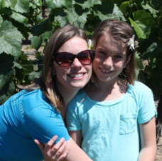 Lee Sweeney and young girl in vineyard