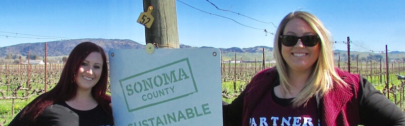 Women standing next to Sonoma sign