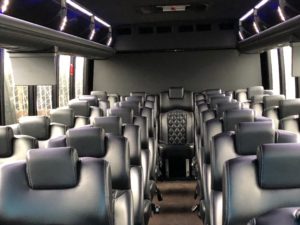 Large charter bus black leather interior